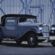 Foto eines grau-schwarz-silbernen Oldtimer-Cabriolets (NAG-Protos Typ 208) von 1930.